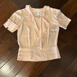 Nice peach top that can be worn with jeans or dressed up